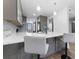 Modern kitchen boasts gray cabinetry, stainless steel appliances, and stunning marble countertops at 8150 Brent St # 725, Port Richey, FL 34668