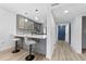 Well-equipped kitchen with pendant lighting and an adjacent hall entry at 8150 Brent St # 725, Port Richey, FL 34668