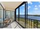 Screened lanai with seating overlooking the water at 8150 Brent St # 725, Port Richey, FL 34668