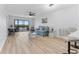 Bright living room with sliding glass doors out to the lanai and water views at 8150 Brent St # 725, Port Richey, FL 34668