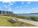 Water view with bench seating; enjoy the serene waterfront lifestyle at 8150 Brent St # 725, Port Richey, FL 34668