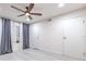 Bedroom with gray wood-look floors, neutral paint, and a modern ceiling fan at 9100 Dr Martin Luther King Jr N St # 1706, St Petersburg, FL 33702