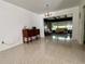 Cozy living room with decorative chandelier, flowing into adjacent dining area at 912 Pineview Ave, Clearwater, FL 33756