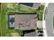 Aerial view of home showing pool, backyard, and proximity to road at 9133 Warm Springs Cir, Parrish, FL 34219
