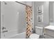 Bright bathroom featuring a bathtub with a colorful shower curtain and subway tile walls at 9133 Warm Springs Cir, Parrish, FL 34219