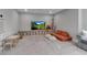Large bonus room with TV and stuffed animals featuring toy storage and seating at 9133 Warm Springs Cir, Parrish, FL 34219