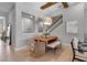 Elegant dining room with stylish chandelier, comfortable seating, and bright natural light at 9133 Warm Springs Cir, Parrish, FL 34219