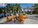 Community firepit with Adirondack chairs and a lake view at 9133 Warm Springs Cir, Parrish, FL 34219
