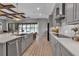 This gourmet kitchen features a large island, stainless appliances, and views of the water at 9133 Warm Springs Cir, Parrish, FL 34219