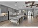Spacious kitchen featuring gray cabinets, island with barstool seating, and modern appliances at 9133 Warm Springs Cir, Parrish, FL 34219