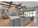 Gorgeous kitchen with an island, stainless steel appliances, and views of an outdoor seating area at 9133 Warm Springs Cir, Parrish, FL 34219