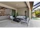 Relaxing outdoor area featuring comfortable seating, a fire pit, and an adjacent indoor living space at 9133 Warm Springs Cir, Parrish, FL 34219