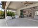 Stylish patio with comfortable seating, seamlessly connected to the kitchen and living areas at 9133 Warm Springs Cir, Parrish, FL 34219