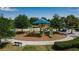Aerial view of the community playground with slides, swings, and benches at 9133 Warm Springs Cir, Parrish, FL 34219