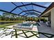 The luxurious pool and spa area has a screened-in lanai and faces a beautiful lake at 9133 Warm Springs Cir, Parrish, FL 34219
