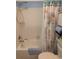 Bathroom featuring a seashell-themed curtain, a towel and a showerhead at 9208 37Th N St, Pinellas Park, FL 33782