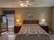 Bedroom with ceiling fan, blinds, and matching night stands at 9208 37Th N St, Pinellas Park, FL 33782