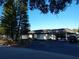Exterior of the golf club house, featuring parking, trees, and prominent signage at 9208 37Th N St, Pinellas Park, FL 33782