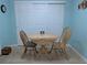 Bright dining area featuring tile floors and a table with chairs next to large closet with sliding doors at 9208 37Th N St, Pinellas Park, FL 33782