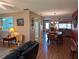 Open-concept living/dining area features wood floors, providing ample space for entertaining at 9208 37Th N St, Pinellas Park, FL 33782