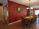 Dining room with rustic decor, chandelier, and a glimpse of the living room at 9208 37Th N St, Pinellas Park, FL 33782