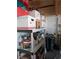Garage interior with storage shelves, cleaning supplies, and utility items at 9208 37Th N St, Pinellas Park, FL 33782