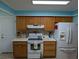 Updated kitchen features an oven, stove, and white refrigerator at 9208 37Th N St, Pinellas Park, FL 33782