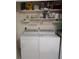 A well-equipped laundry room with modern washer, dryer, and shelving provides functionality at 9208 37Th N St, Pinellas Park, FL 33782
