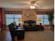 Comfortable living room is filled with natural light and features plush sofas at 9208 37Th N St, Pinellas Park, FL 33782