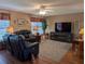 Comfortable living room featuring plush sofas and large entertainment center at 9208 37Th N St, Pinellas Park, FL 33782