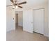 Neutral bedroom boasting a ceiling fan and double door closet at 6711 3Rd N St, St Petersburg, FL 33702