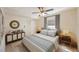 Cozy bedroom featuring neutral decor, tiled floors, and a window that offers ample natural light and a closet at 6711 3Rd N St, St Petersburg, FL 33702