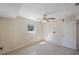 Bedroom featuring tile floors, ceiling fan with light, neutral walls, and lots of natural light at 6711 3Rd N St, St Petersburg, FL 33702
