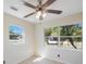 Bright bedroom offering two windows and a ceiling fan at 6711 3Rd N St, St Petersburg, FL 33702