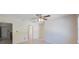 Well-lit room with tiled floors, neutral paint, and natural light streaming through the large windows and doorway at 6711 3Rd N St, St Petersburg, FL 33702