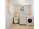 Functional laundry room area with washer, dryer, and water heater at 6711 3Rd N St, St Petersburg, FL 33702