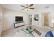 Comfortable living room featuring a ceiling fan, tiled floors, and neutral paint that create a relaxing vibe at 6711 3Rd N St, St Petersburg, FL 33702