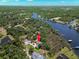 Desirable waterfront property with private dock and lush landscaping, offering serene water views at 10905 Elliot St, Riverview, FL 33578