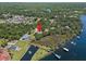 Stunning waterfront home featuring a private dock, pond, and mature landscaping at 10905 Elliot St, Riverview, FL 33578