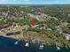 Waterfront home with a private dock and tranquil pond, surrounded by verdant trees at 10905 Elliot St, Riverview, FL 33578