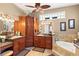 Large primary bathroom with a double sink vanity, tiled floor and plenty of storage at 10905 Elliot St, Riverview, FL 33578