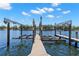 Boat lift on dock on the water and views of waterfront homes across the water at 10905 Elliot St, Riverview, FL 33578