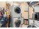 Efficient laundry room with stacked washer and dryer and plenty of storage at 10905 Elliot St, Riverview, FL 33578
