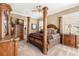 Spacious main bedroom featuring a four poster bed with ornate accents and neutral decor at 10905 Elliot St, Riverview, FL 33578