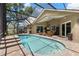 Beautiful screened-in pool with a lounge area, perfect for outdoor entertainment at 10905 Elliot St, Riverview, FL 33578