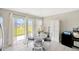 Bright dining area with a view, featuring access to the backyard and ample natural light at 11221 Gold Compass St, Gibsonton, FL 33534