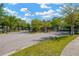 Community entrance with gated entry and stone columns, surrounded by mature trees and landscaping at 11221 Gold Compass St, Gibsonton, FL 33534