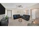 Spacious living area with comfortable seating, neutral decor, and easy access to the dining and kitchen areas at 11221 Gold Compass St, Gibsonton, FL 33534