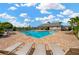 Community pool area featuring comfortable lounge chairs and a covered pavilion for relaxation at 11221 Gold Compass St, Gibsonton, FL 33534