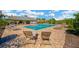 Community pool with chairs, tables, and a covered pavilion for residents' enjoyment at 11221 Gold Compass St, Gibsonton, FL 33534